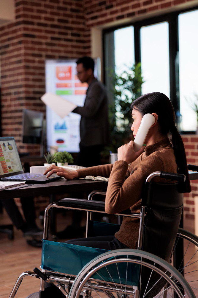 asian-woman-with-physical-impairment-talking-landline-phone-having-remote-conversation-office-telephone-wheelchair-user-with-chronic-health-condition-chatting-phone-call